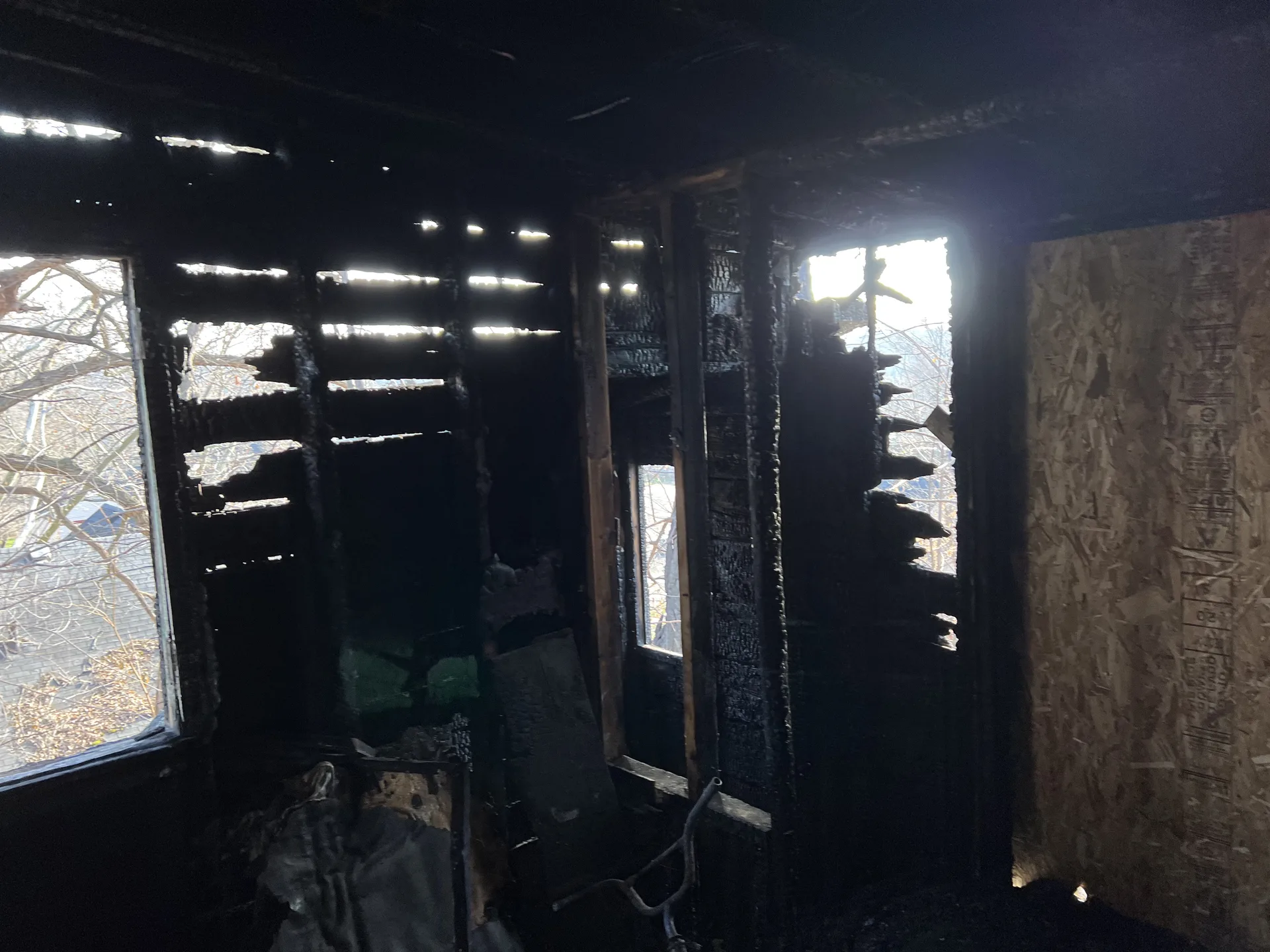 Kitchen soot deposit after grease fire in Grand Rapids MI home showing protein smoke film on cabinets and walls