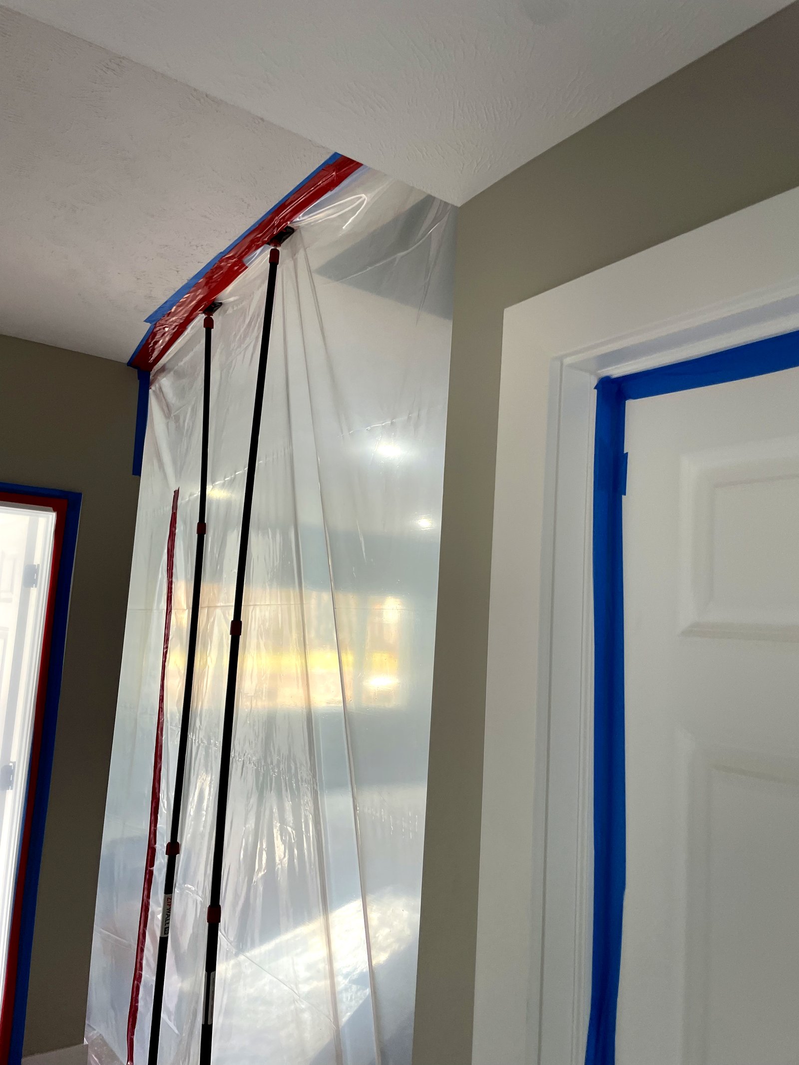 Professional containment barrier protecting home during restoration — Grandville, MI